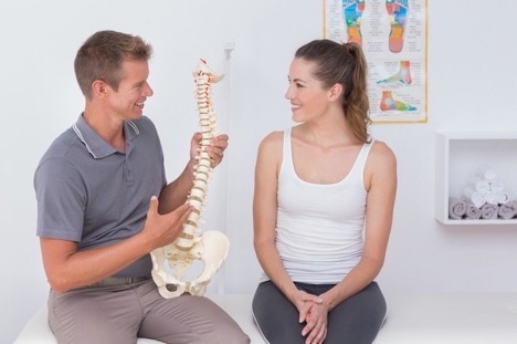 Chiropractor Explaining the Causes of Back Pain