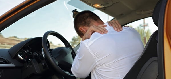 Man Holding Neck After a Whiplash Injury During a Car Accident