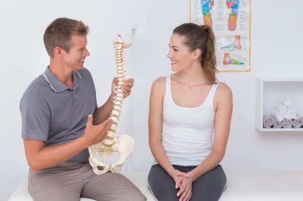 Chiropractor Explaining Spine Function to Patient in Hawthorne Florida