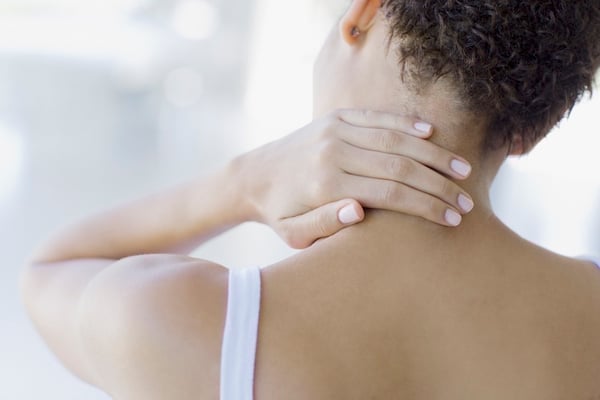 Woman Holding Neck After an Injury